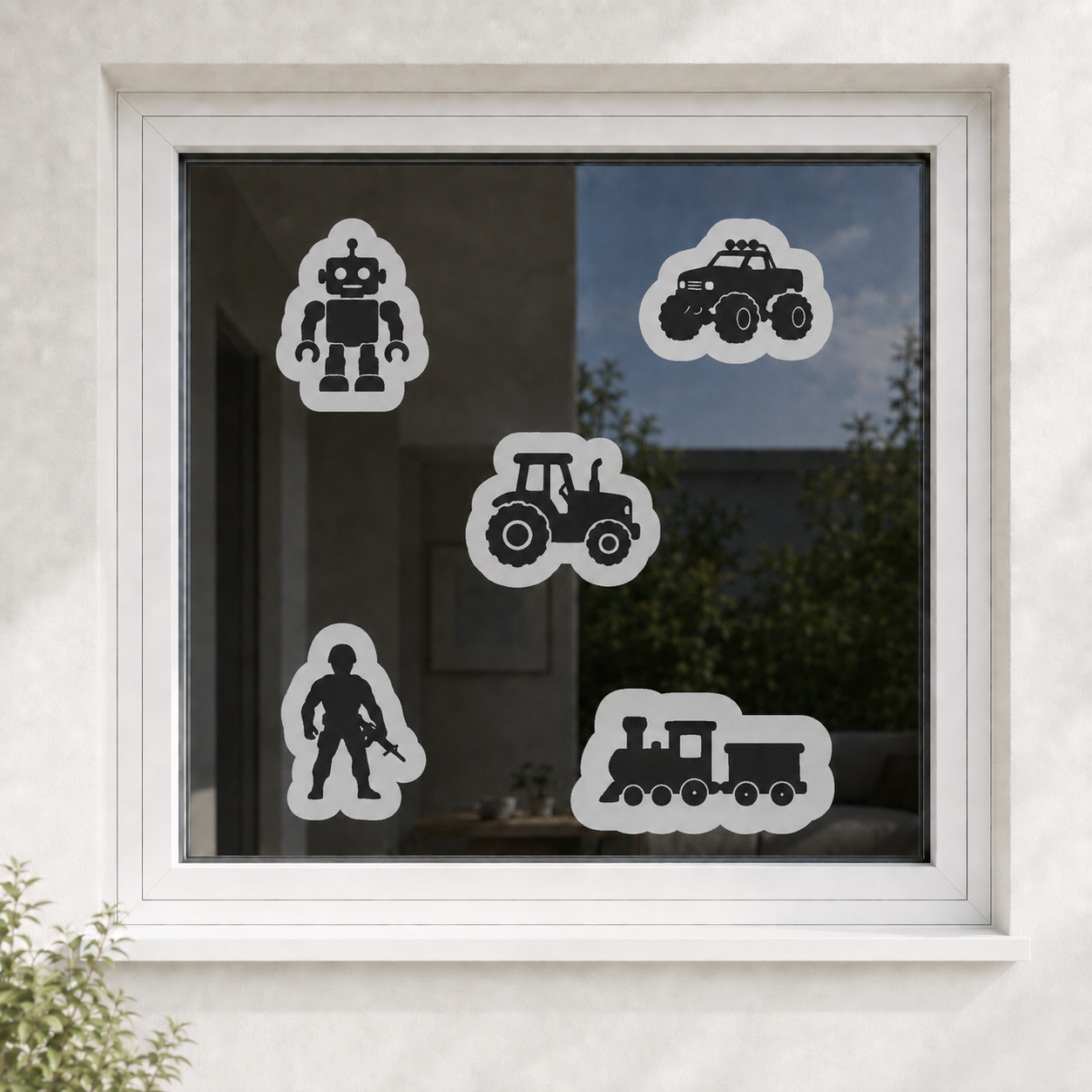 Dekorative Vogelretter-Motive auf einer Fensterscheibe